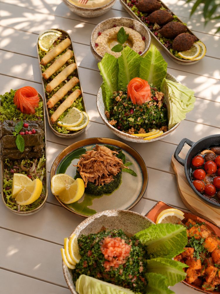 Lebanese mezze spread with tabbouleh, moutabbal, warak enab, cheese rolls and kebbeh